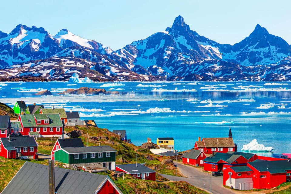 A photo of a town with mountains in the background